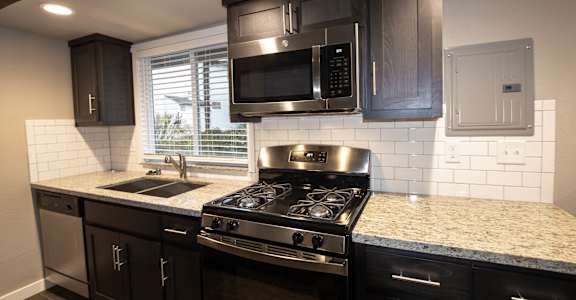 Kitchen with granite counters and stainless appliances and double sink