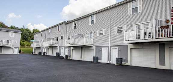 the view of a building with a parking lot