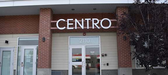 The front of a building with the word CENTRO on it.