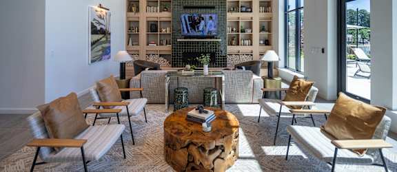 A living room with a fireplace and a television.