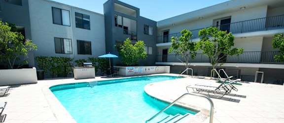 swimming pool in the courtyard of an apartment building