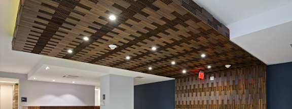 a spacious lobby with a reception desk and a seating area