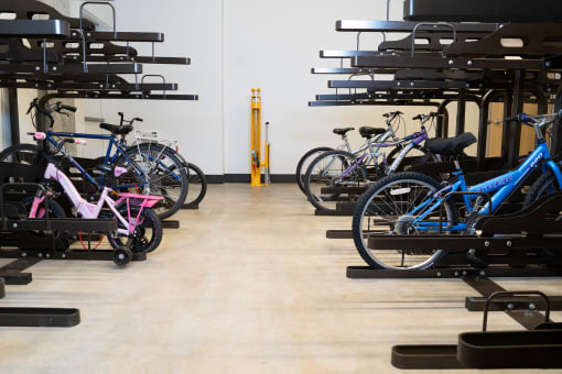 a group of bikes parked in a bike store