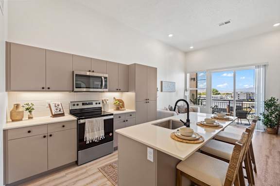 Large Island Kitchen With Custom Cabinetry at Solhavn Apartments, American Fork, UT, 84003