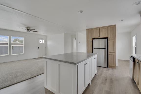 a kitchen and living room in a 555 waverly unit