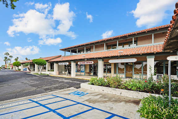 A parking lot with a blue painted crosswalk.