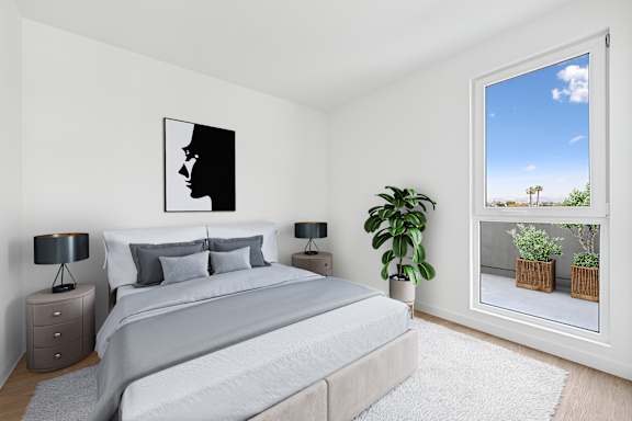 A bedroom with a large bed and a window with curtains at Coro in Los Angeles
