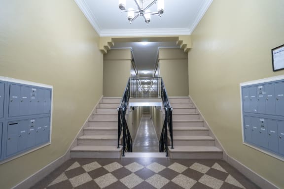 theoyer of a school building with stairs and lockers