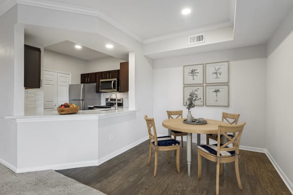 an open kitchen and dining room with a table and chairs at The Legends at Eagle Mountain Lake, Fort Worth, TX
