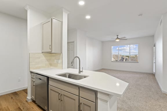 an empty kitchen with a sink and a window at The Legends at Eagle Mountain Lake, Texas