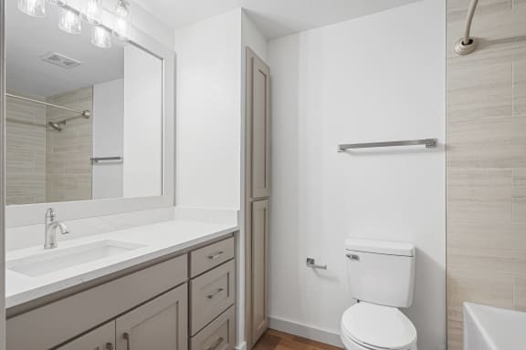 a bathroom with a sink toilet and a mirror at The Legends at Eagle Mountain Lake, Texas, 76179