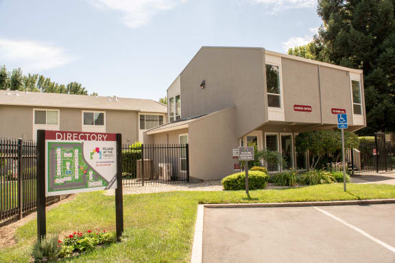 a building with a directory sign in front of it