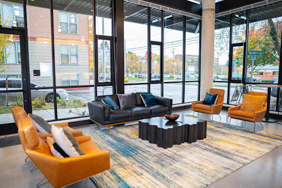 a lobby with couches and chairs and a coffee table