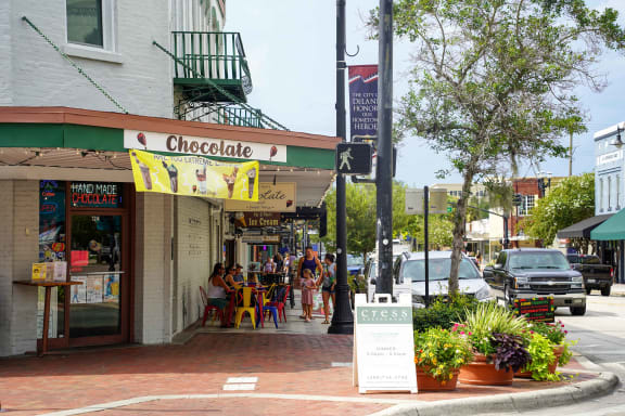 a street corner with a chocolate shop on the corner