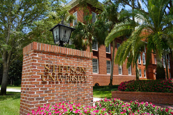 a brick wall with the st sign in front of a building