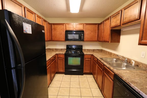 a living room and kitchen with a dining table