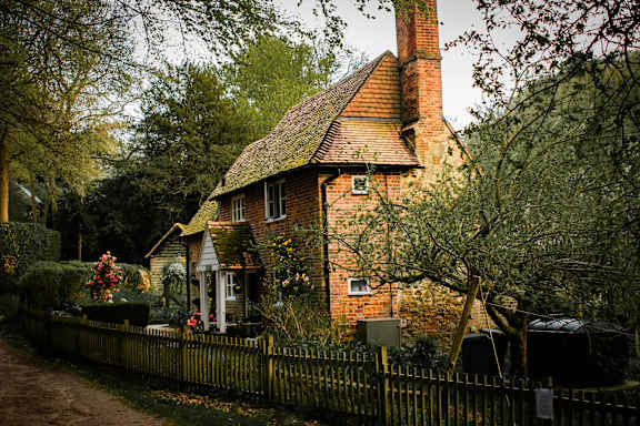 A house with a red brick chimney and a white door.