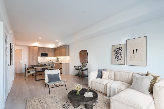 a living room with a white couch and a table