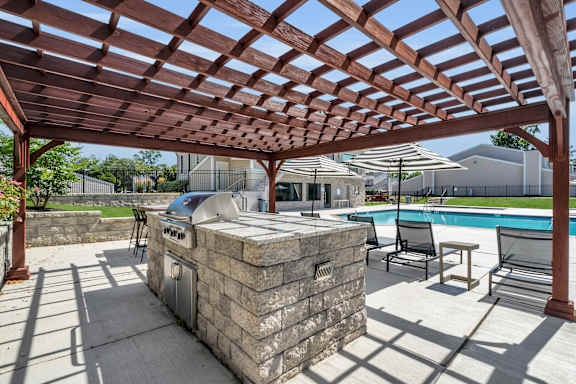 A patio with a grill and a pool Townhomes at Gateway, Bensalem, Pennsylvania
