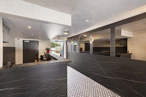 A black and white checkered floor in a modern building.