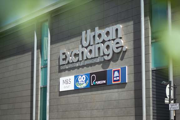 Sign for Urban Exchange at Fairfax Apartments, Manchester, M1 2GN