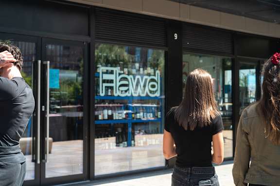 People standing outside a store at Fairfax Apartments, Manchester, M1 2GN
