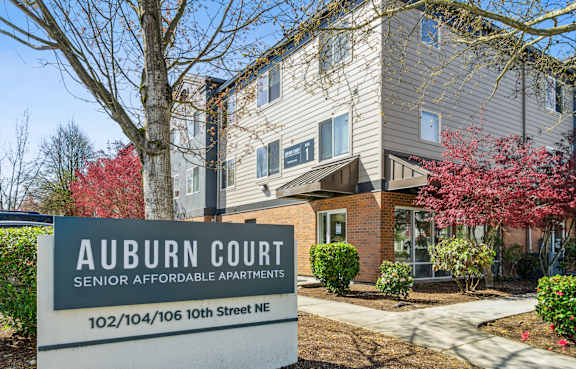 Exterior monument sign at Auburn Court Apartments in Auburn WA