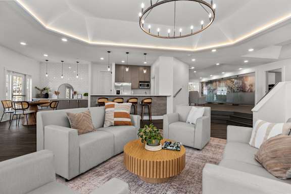 a kitchen with stainless steel appliances and white cabinets