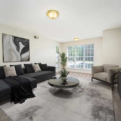a living room with a couch and a table