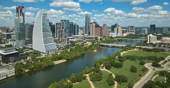A cityscape with a river running through it.