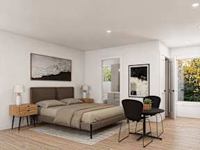 A bedroom with a bed, chair, and two lamps.