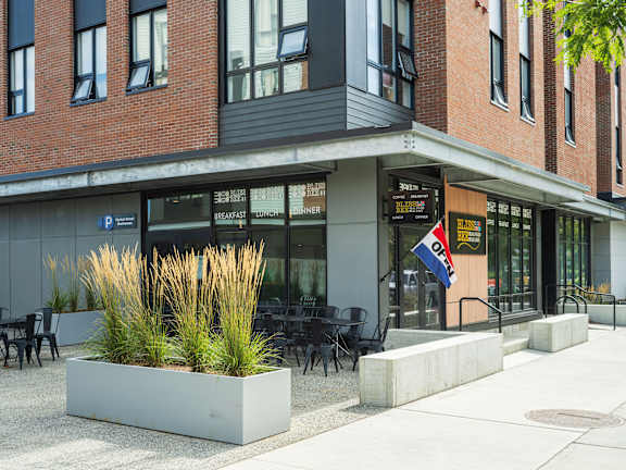 A building with a sign that says "Breakfast Dinner" on it.