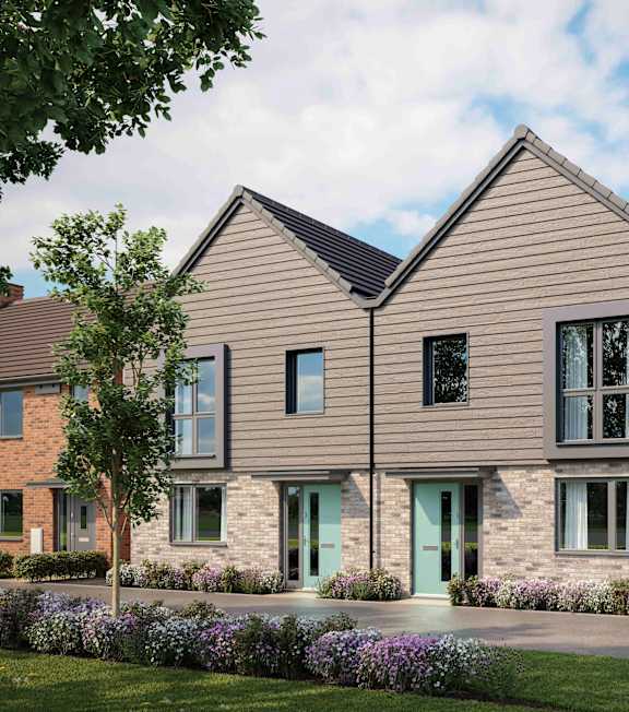 A modern house with a grey front and a green door at The Foundry Apartments, Bordon