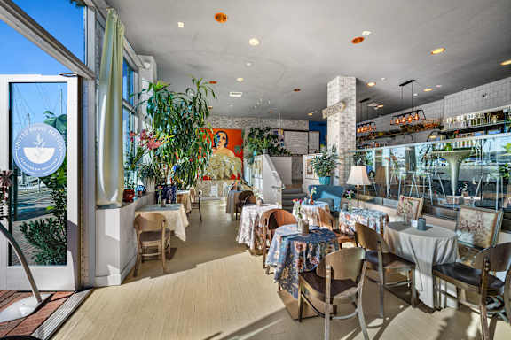 a selection of bowls of food on a table with a blue logo at Esprit Apartments, Marina del Rey, 90292