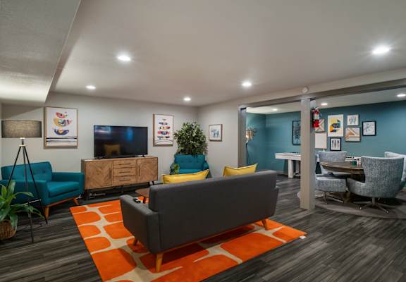 a living room with couches and chairs and a tv at Cedarwood, Wenatchee, WA