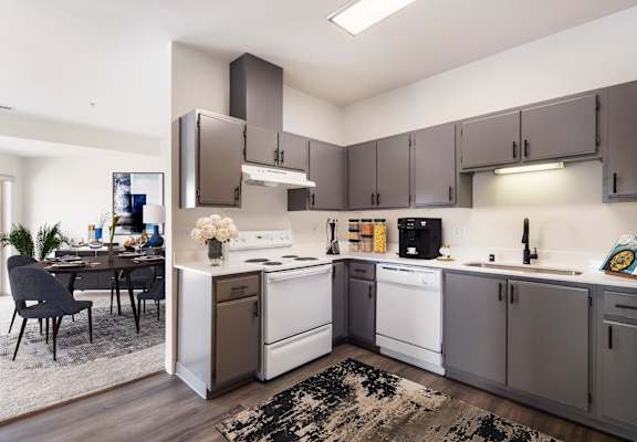 a kitchen with white appliances and gray cabinets  at Shoreline Village, Richland, 99352