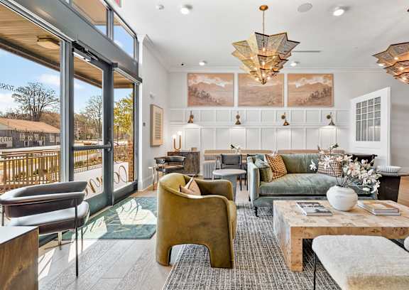 A living room with a green couch and a coffee table.