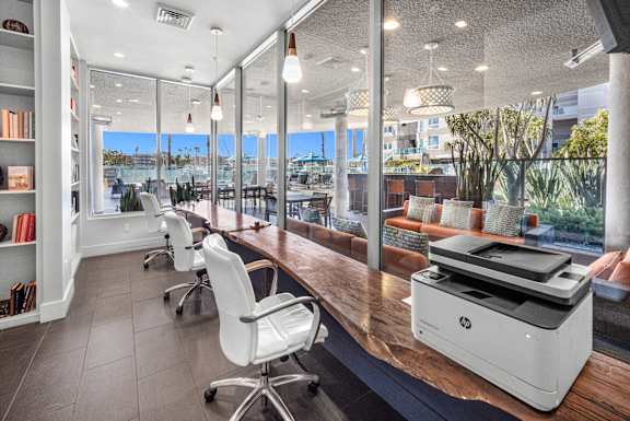 A modern office with a large printer on the desk. at Esprit Apartments, California