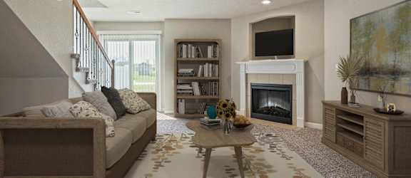 a living room with a couch and a fireplace