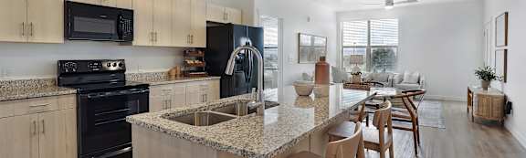 Alvera at the Meadows Apartments in American Fork, Utah Model Kitchen with Island