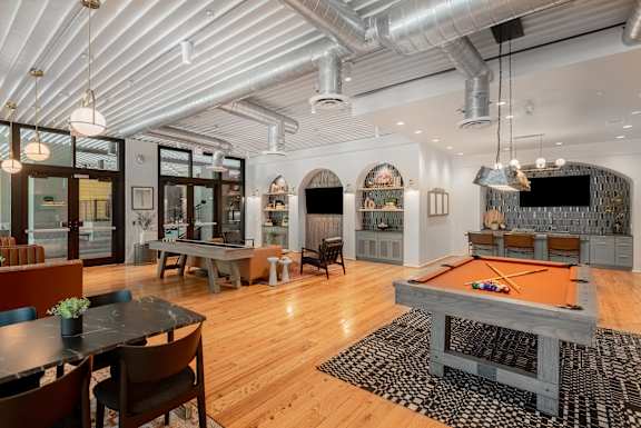 a game room with a pool table and a television The Can Plant,  Luxury Apartments in San Antonio
