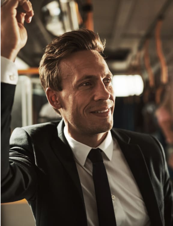 a man in a suit on a bus at NoMa Apartments, California, 94596