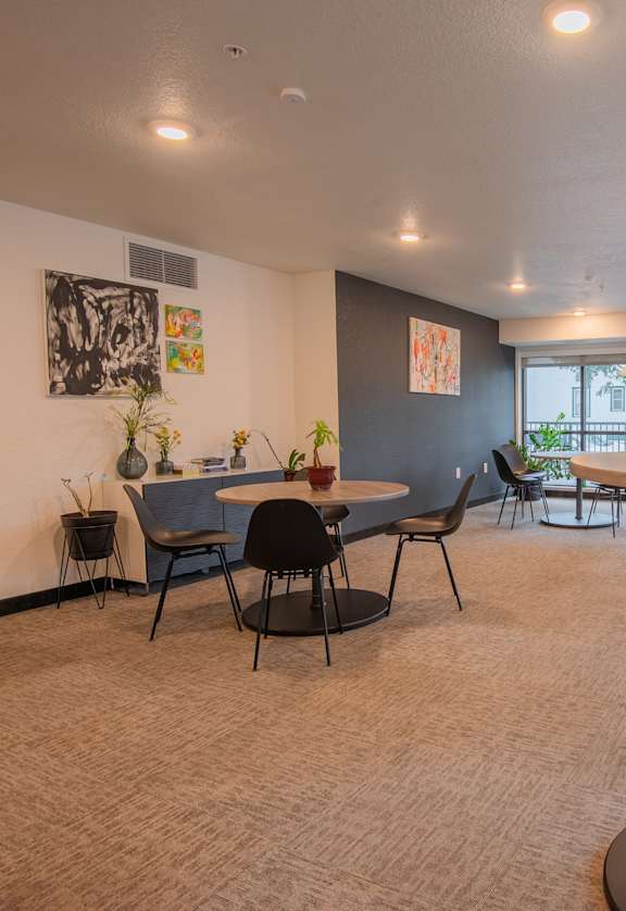A room with a table and chairs in it.
