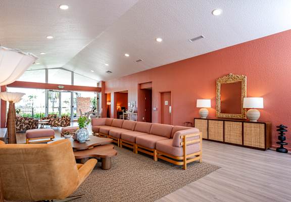 A living room with a brown sofa and a wooden coffee table.