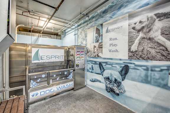 A dog washing station with a sign that says  at Esprit Apartments, California, 90292