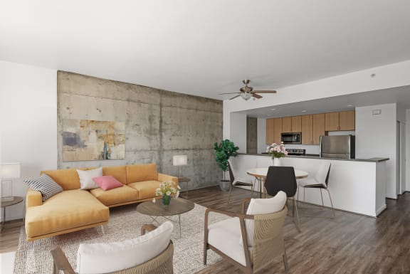 Living room with concrete accent wall and kitchen at Vendome Place, San Jose, California