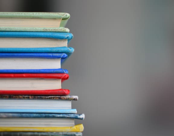 a stack of books on a table