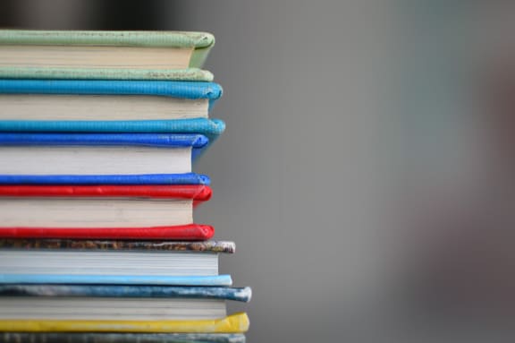 a stack of books on a table at 11 Cooper Apartments, Camden,New Jersey, 08102