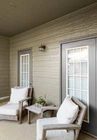 Patio with Glass door at Deer Creek Apartment Homes, Overland Park