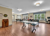 Thumbnail 11 of 54 - A conference room with a long table and chairs.